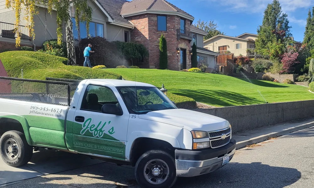 technician working on customer's lawn